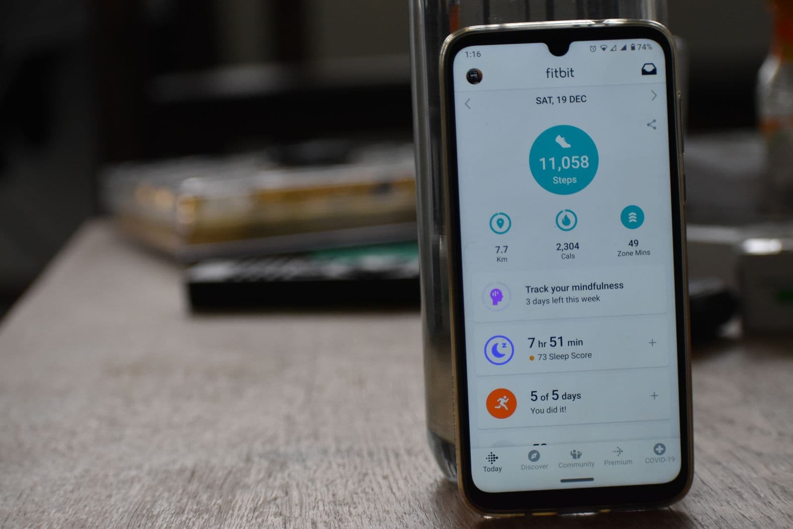 Smartphone displaying a fitness tracking app with health statistics