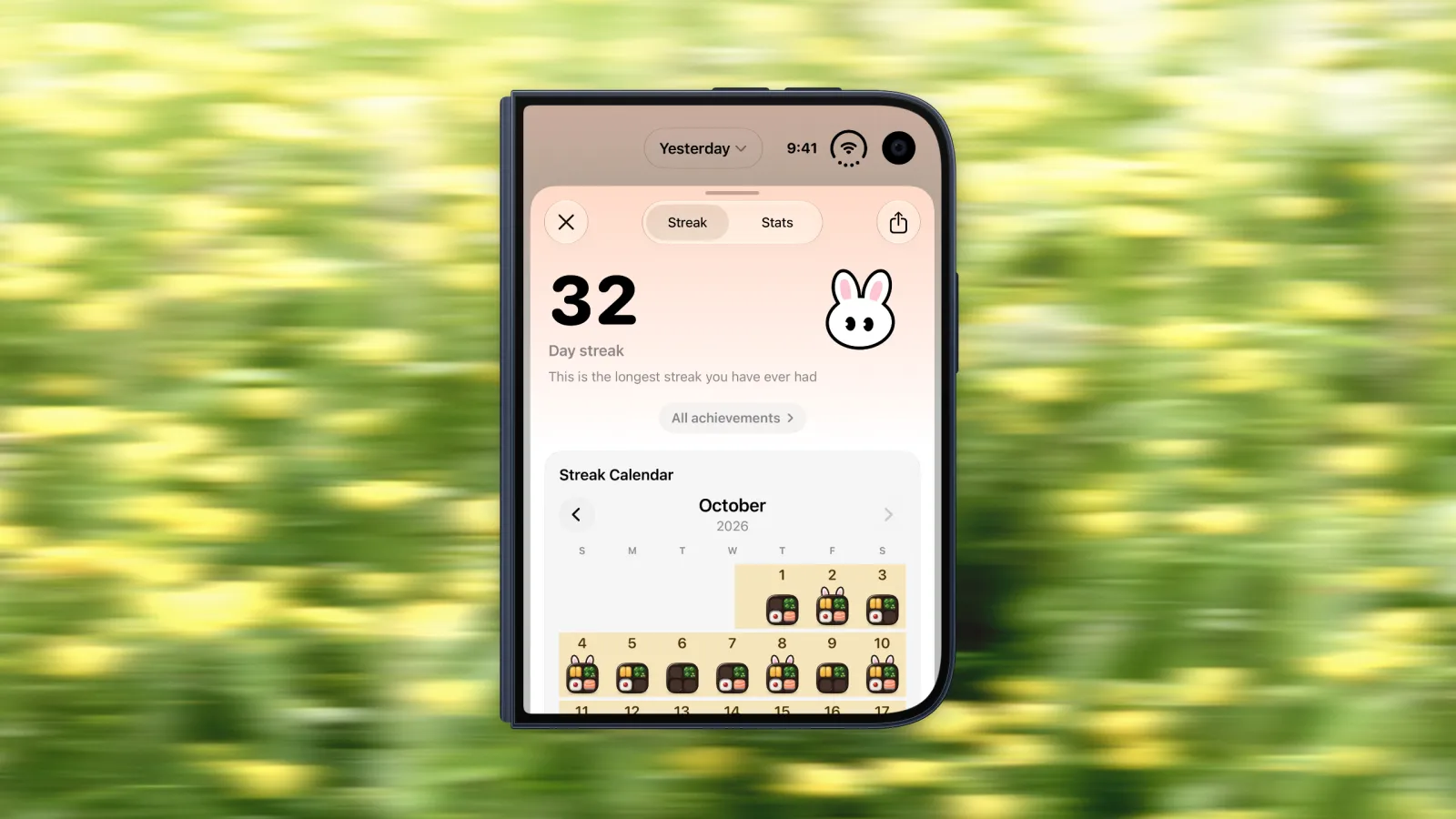 Bento Bunny's streak screen on iPhone Duo showing a 32 day streak and a streak calendar with a bento box on every logged day